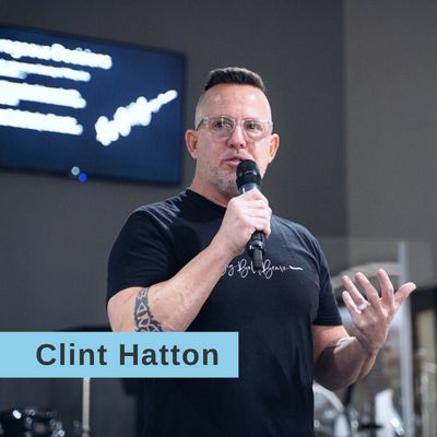 Clint Hatton speaking on a stage